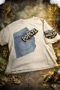 CZDE x Popeye Denim Patch Tee flat lay back – raw denim panel with Popeye crew DTF print and CZDE stone logo on dark editorial background with chains and spray cans