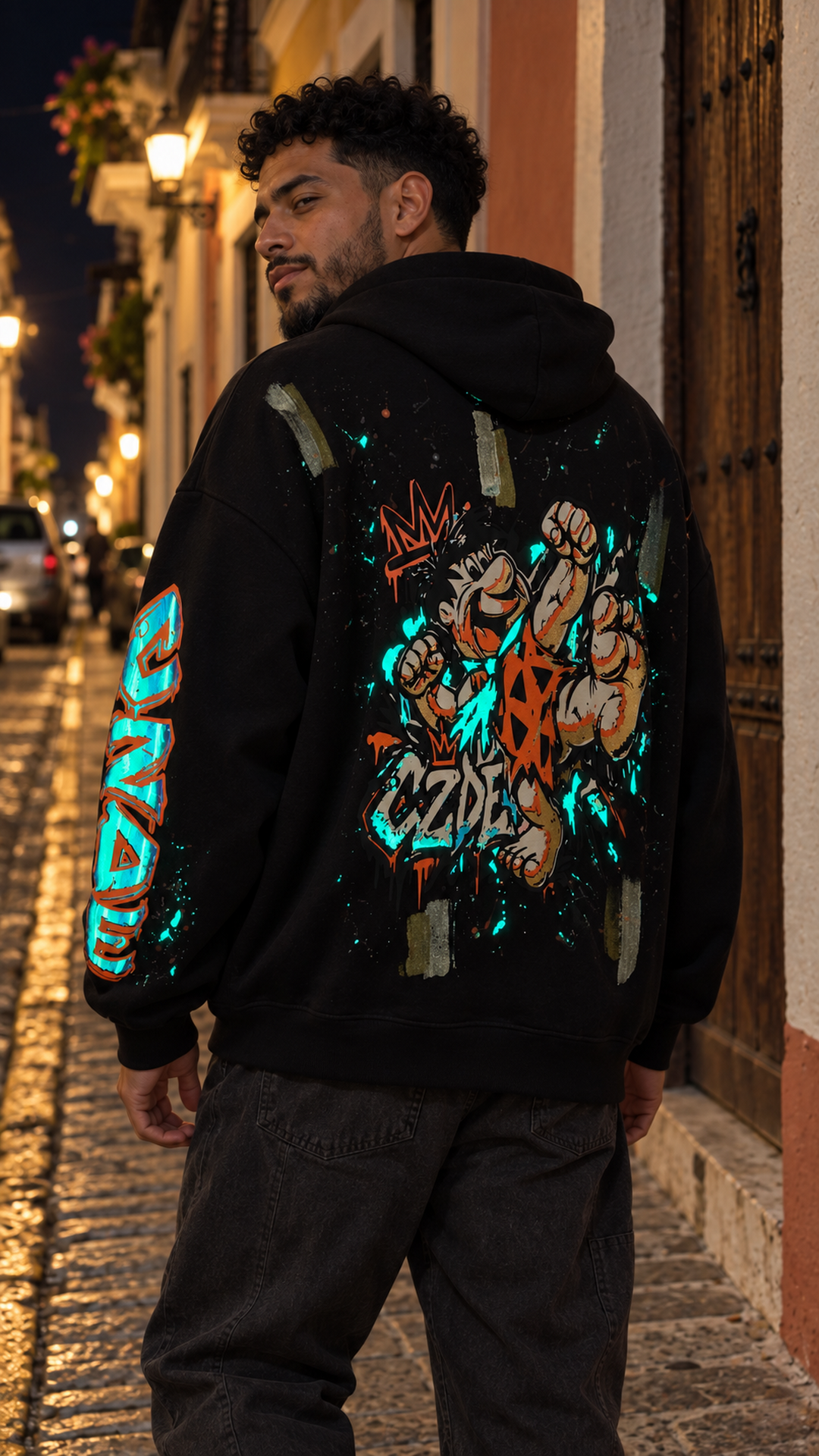 Black oversized hoodie with colorful graffiti back artwork and matching sleeve print