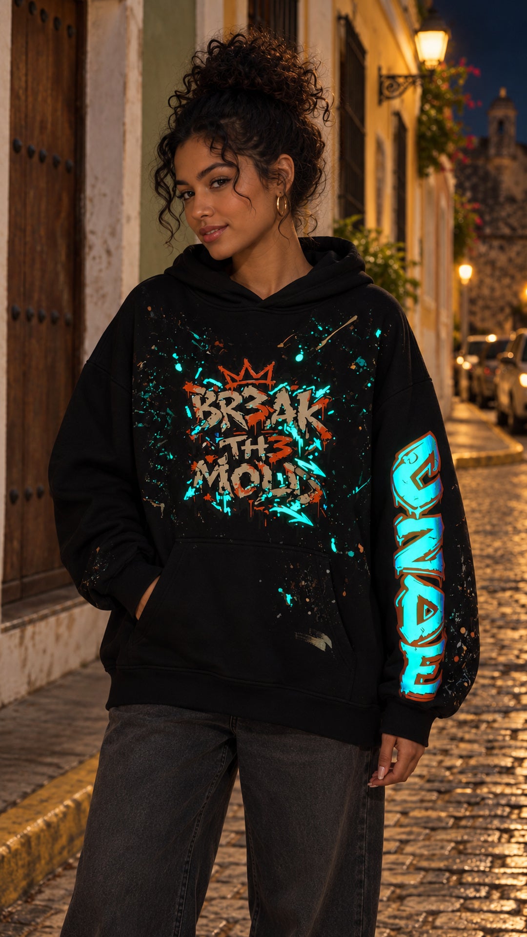 Black oversized hoodie with colorful graffiti chest design and graffiti sleeve graphic