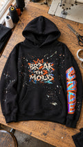 Black oversized hoodie with hand-painted graffiti splatter and front kangaroo pocket