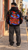 Black oversized hoodie with colorful wizard “Break the Spell” graphic on back