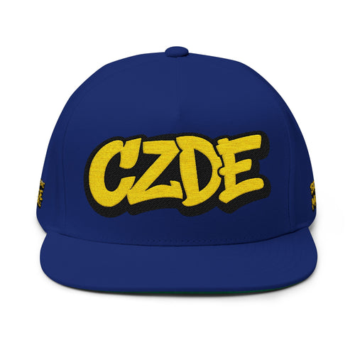 Navy flat-bill snapback cap with embroidered CZDE logo in yellow and black.