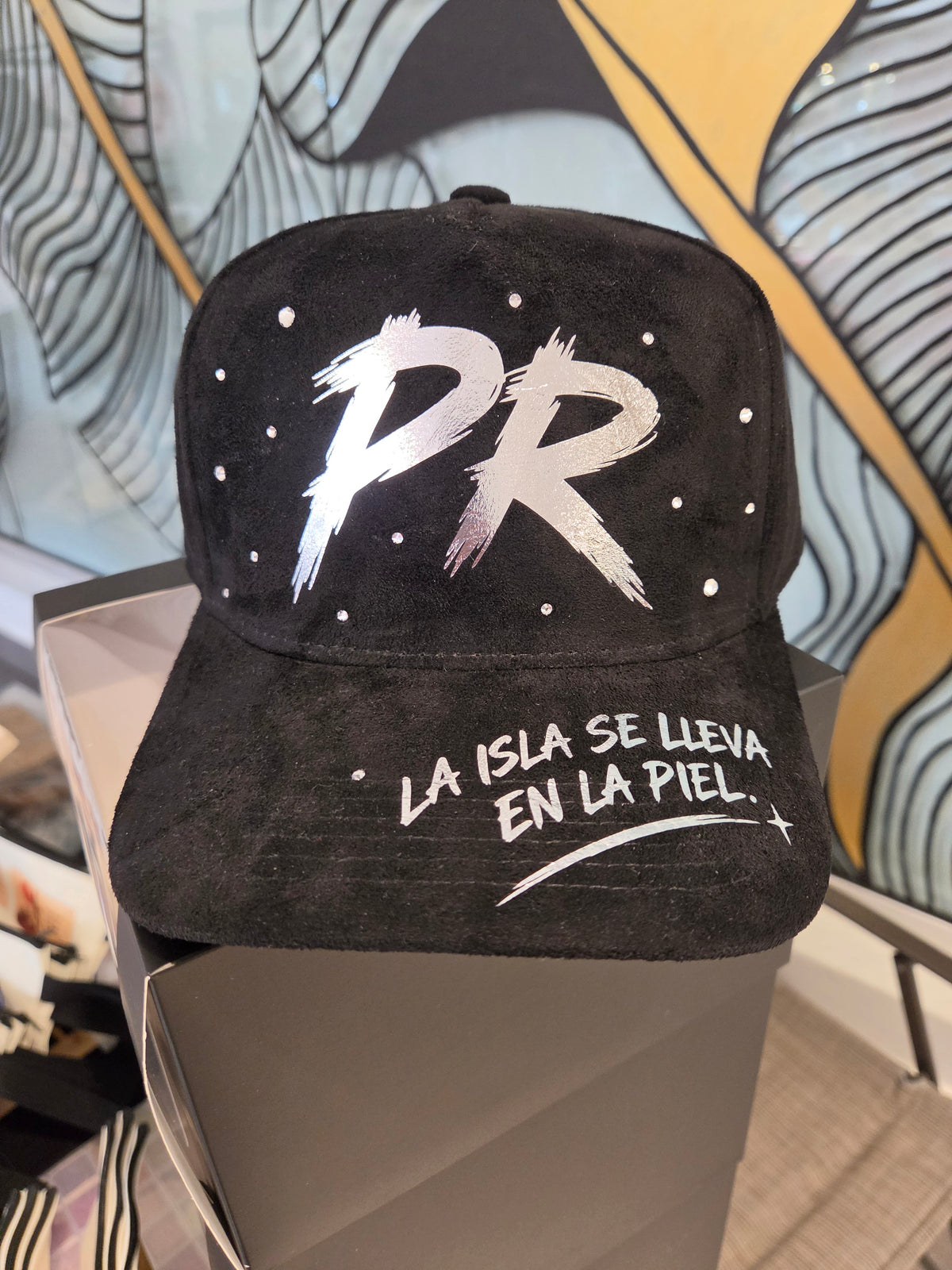 Handmade black baseball cap with large white PR graffiti and “LA ISLA…” text